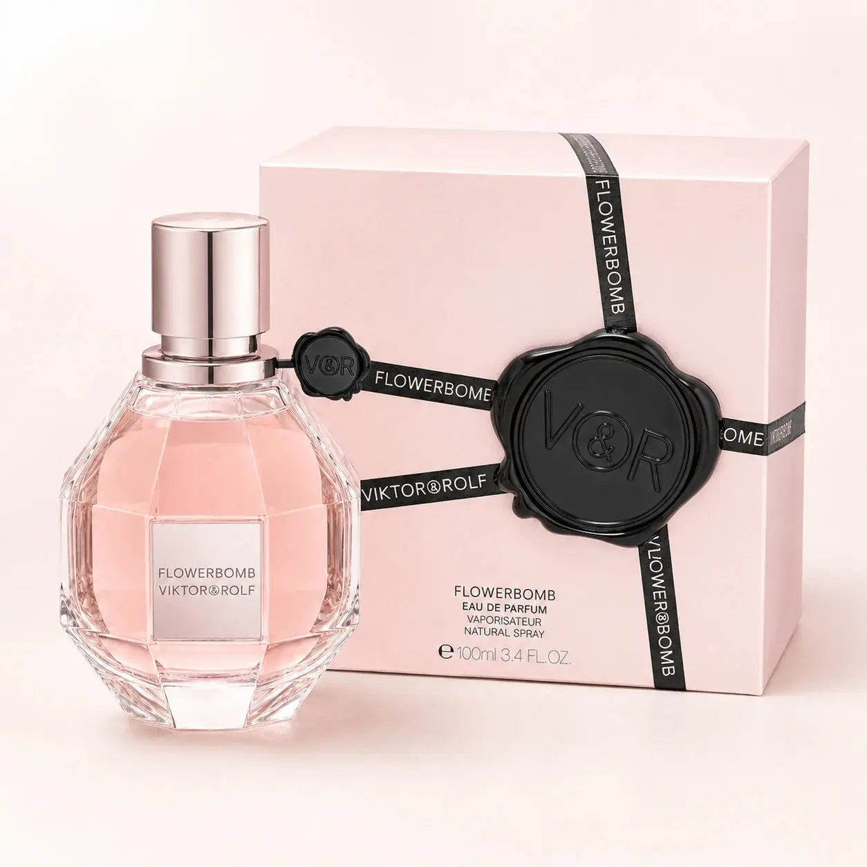 Viktor & Rolf Flowerbomb 100ml EDP women's perfume clean product image showing the original bottle and pink box on a bright studio background.