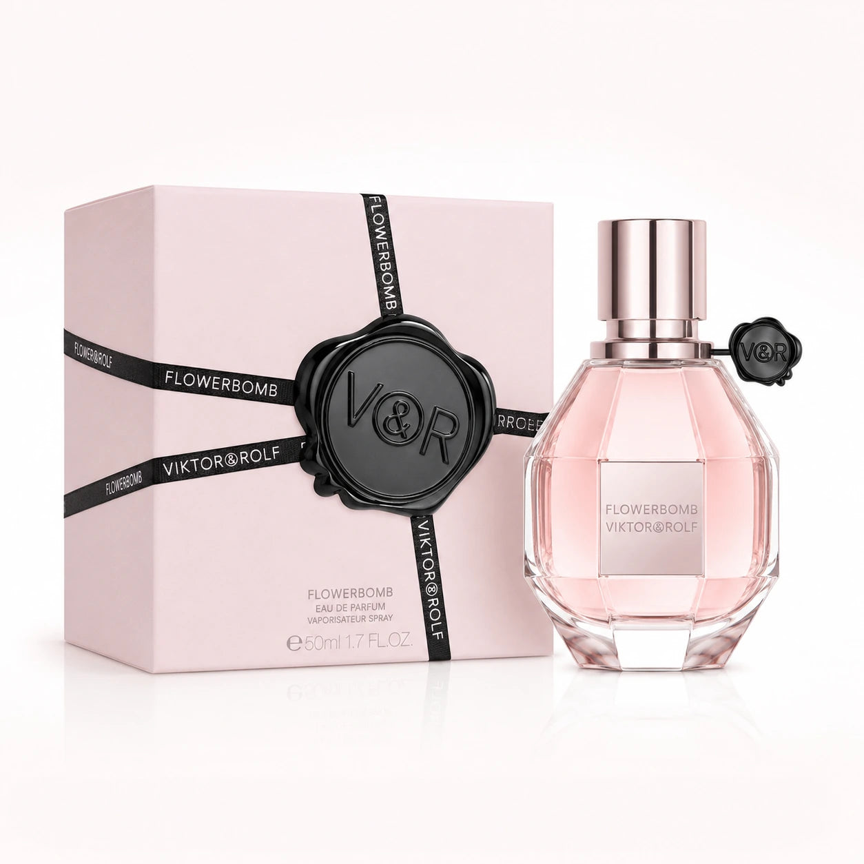 Viktor & Rolf Flowerbomb 50ml EDP women's perfume clean product image showing the original bottle and pink box on a bright studio background.