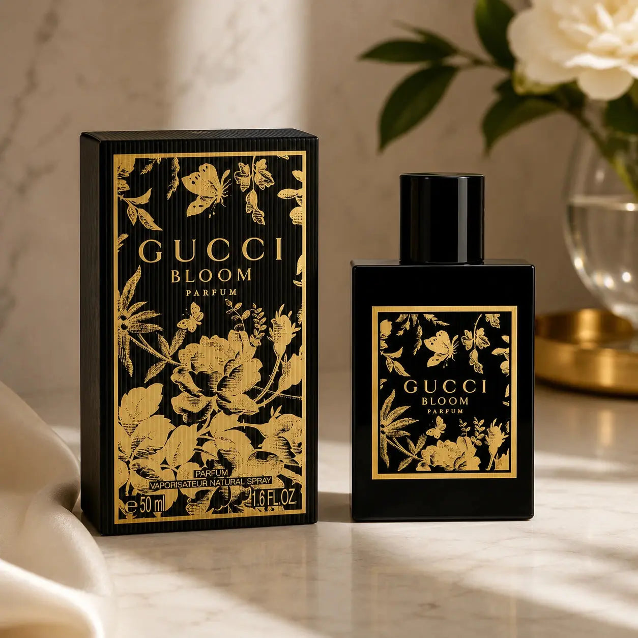 Gucci Bloom Parfum 50ml bottle with moonlit white florals on a gold-trimmed marble podium at Gadgets Online NZ