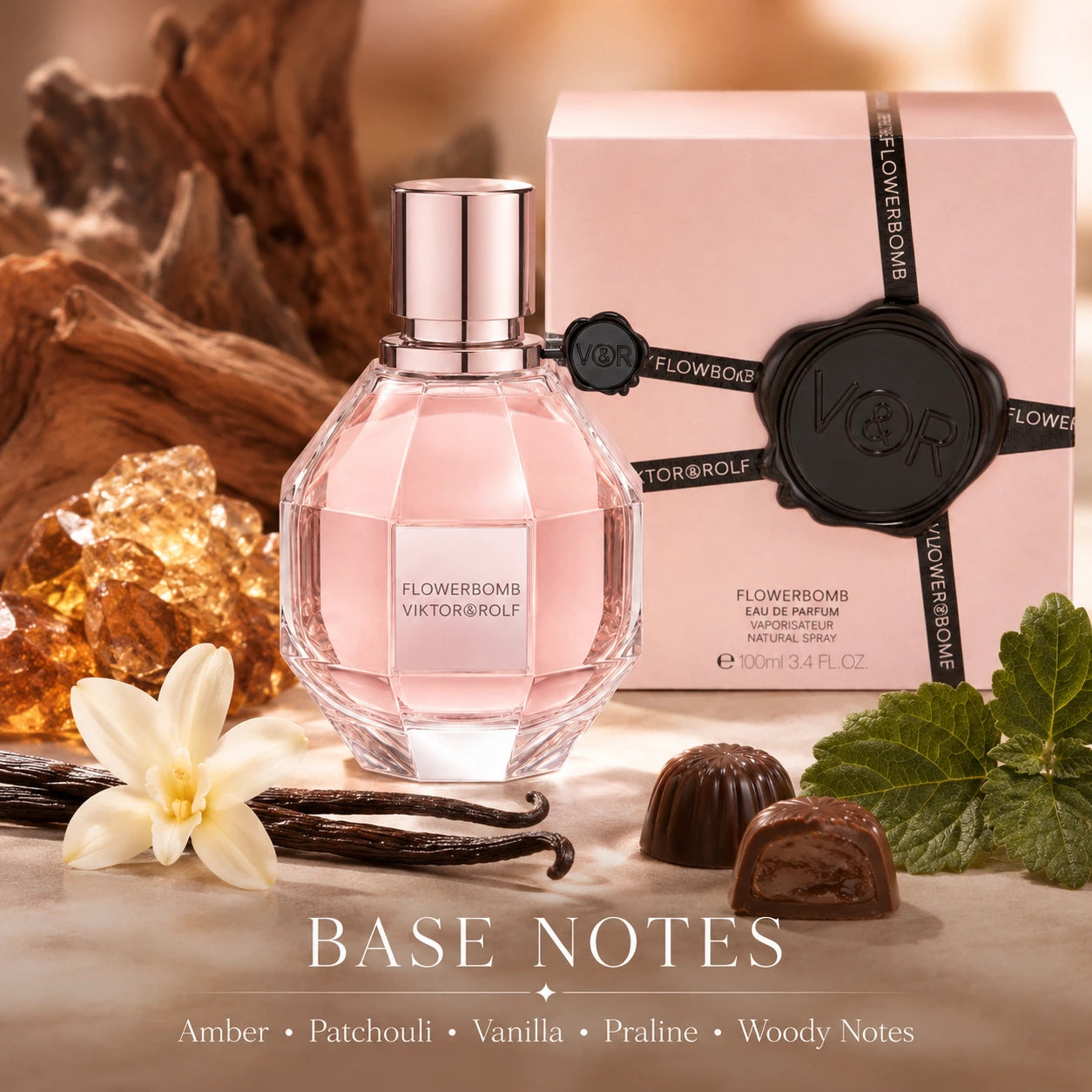 Viktor & Rolf Flowerbomb 100ml EDP base notes image with amber, patchouli, vanilla, praline and woody notes styled around the Flowerbomb bottle and box.