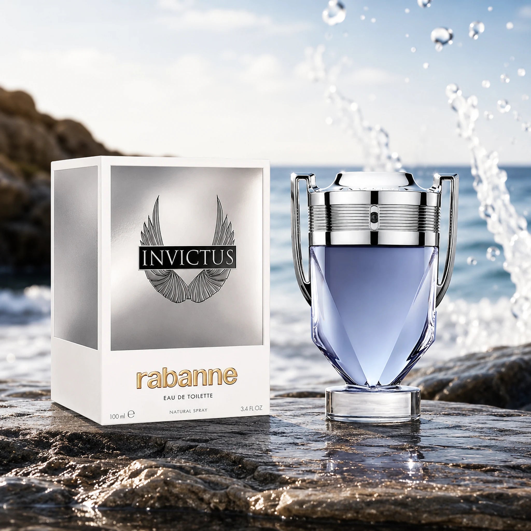 Invictus Rabanne perfume bottle and packaging on a rocky surface with water in the background