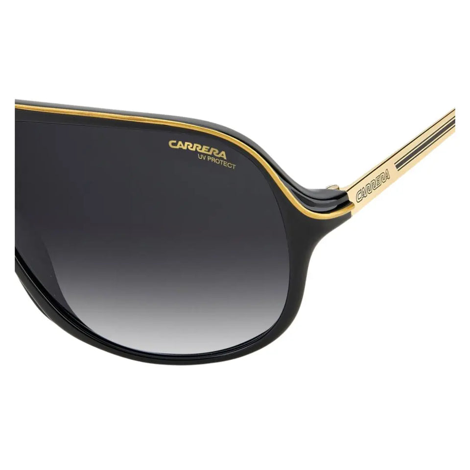Side look Carrera Safari65/N unisex aviator sunglasses with black gradient lenses and gold frame on a white background