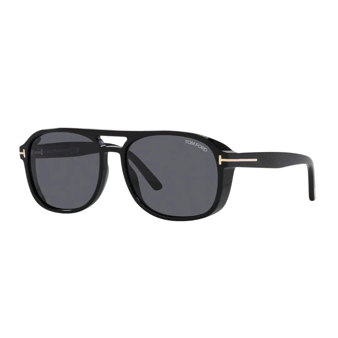 Tom Ford FT1022 Rosco sunglasses for men, featuring a polished shiny black square acetate frame. The solid smoke grey lenses are visible with the signature gold 'T' branding on the temples.