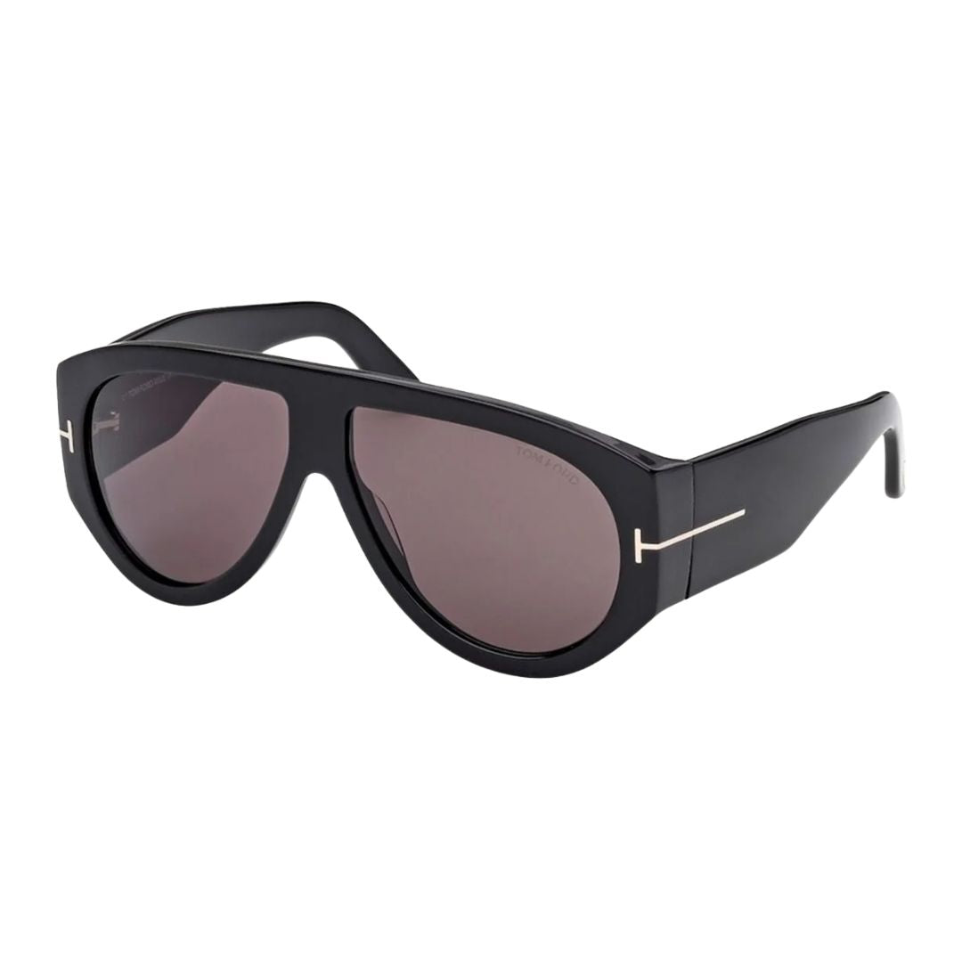 Tom Ford FT1044 Bronson sunglasses for men featuring a classic glossy black acetate aviator frame. The dark smoke grey lenses are complemented by the signature gold 'T' logo at the temples.