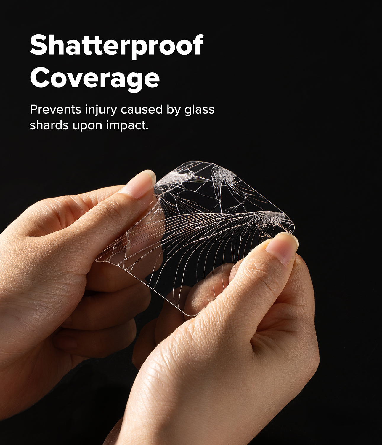 Hands holding a piece of shatterproof material with text on a black background
