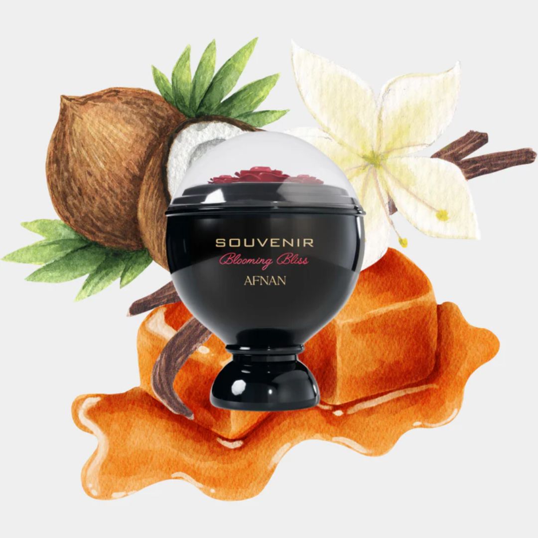 Black perfume bottle labeled 'SOUVENIR' surrounded by vanilla beans, a coconut, and flowers on a light gray background.