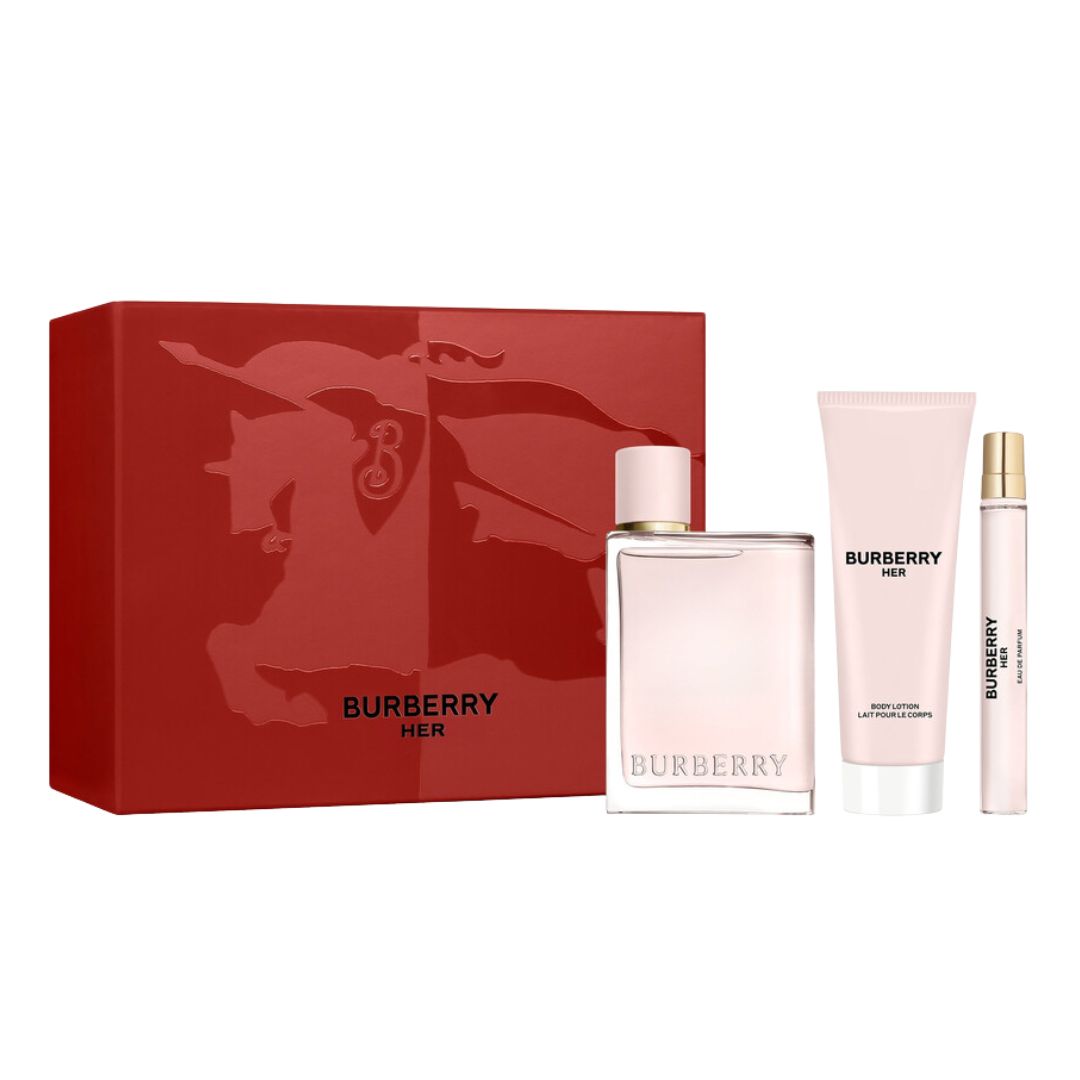 Burberry Her 3pc Gift Set, an elegant light pink box containing the 100ml square bottle, 10ml travel spray, and 75ml body lotion, suggesting a sweet, luminous, and rich fruity-gourmand scent.
