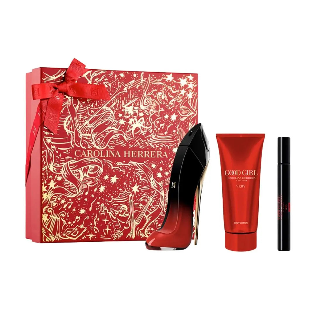 Carolina Herrera Very Good Girl Elixir EDP 80ml 3 Piece Gift Set Women with red high heels, perfume, and lip product on a white background
