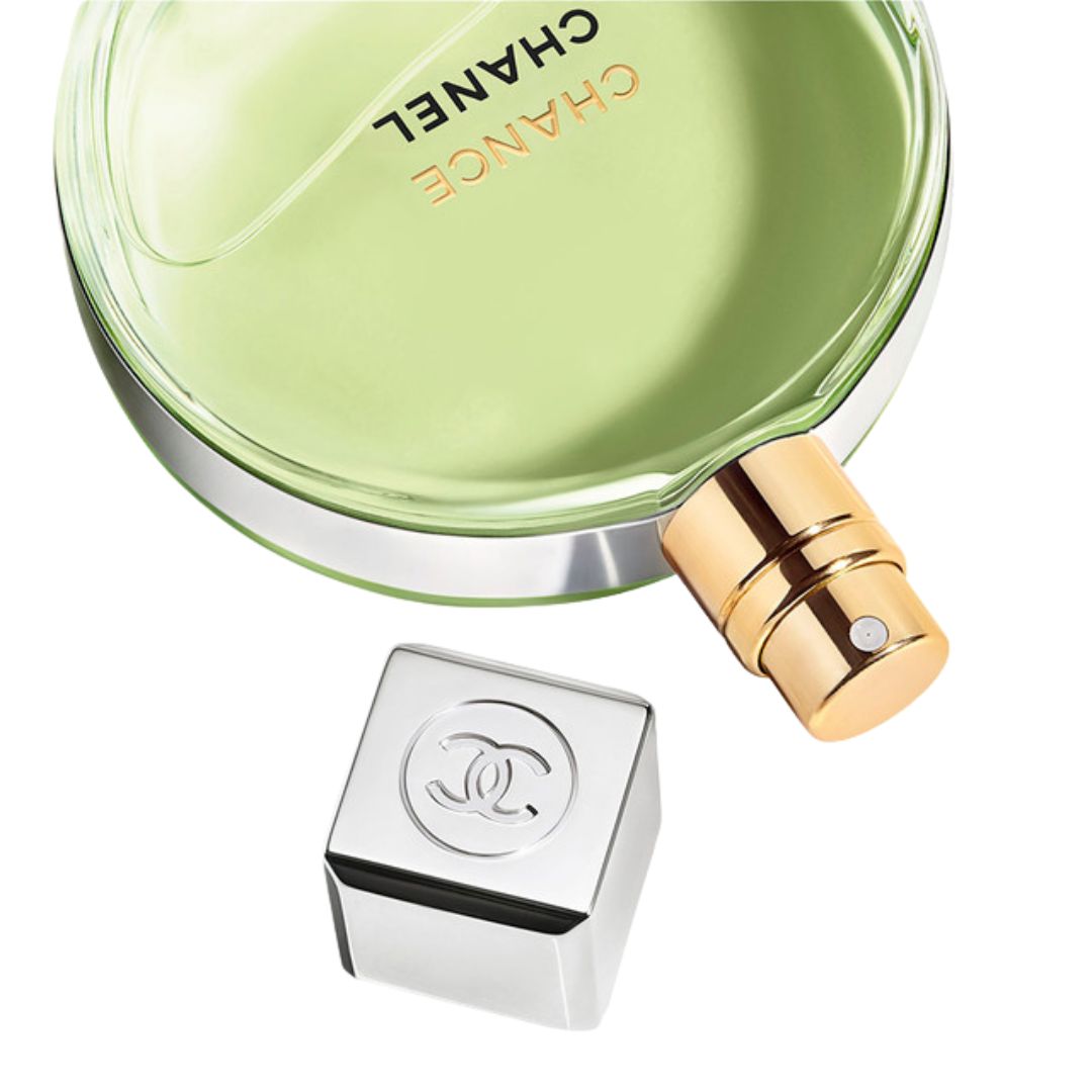 Chanel Chance perfume bottle with silver cap and base on a white background