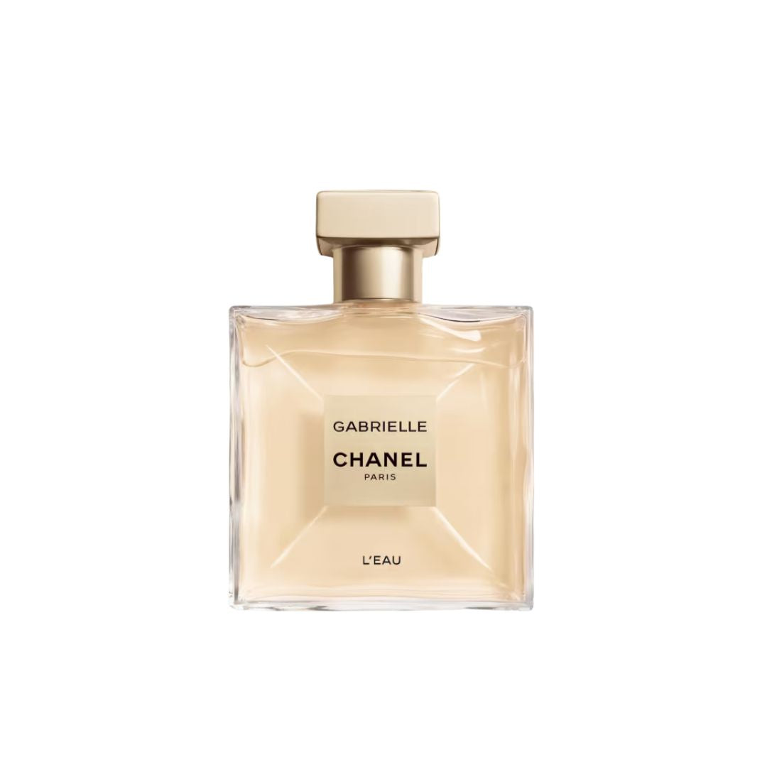 Chanel Gabrielle L'Eau EDT 50ml, a square bottle of ultra-thin glass with a rosy beige-gold cap, suggesting a weightless, fresh, and sparkling fruity-floral feminine scent.