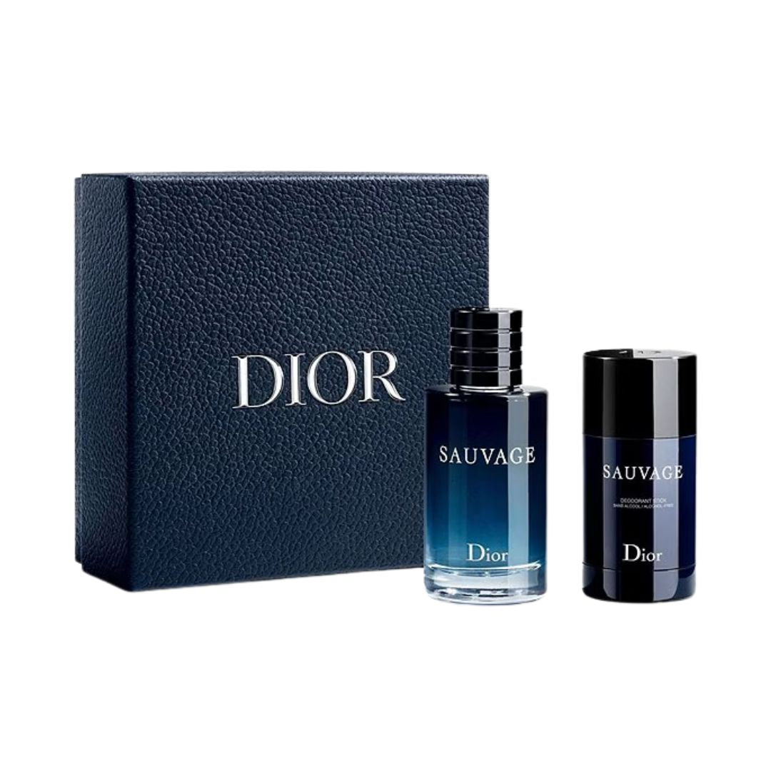 Dior Sauvage fragrance gift set featuring a dark blue textured leather box, a blue-to-clear gradient perfume bottle, and a matching dark blue and black deodorant stick, all with Dior branding on a white background.