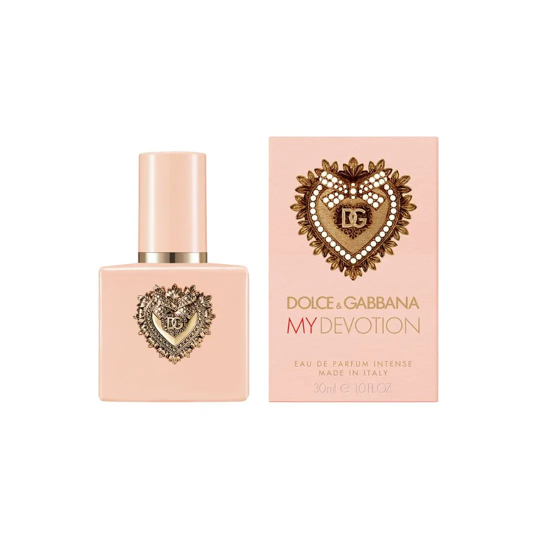Dolce & Gabbana My Devotion Eau de Parfum Intense 30ml bottle next to its pink packaging box, both featuring a gold heart emblem with the 'DG' logo on a clean white background.