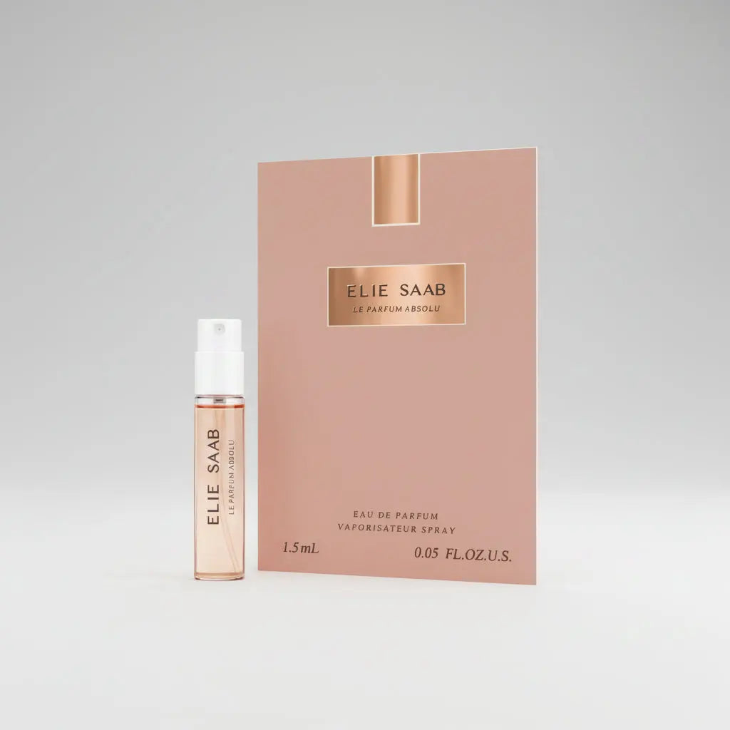 Elie Saab Le Parfum Absolu eau de parfum spray shown with its pink packaging box and a 1.5 mL sample spray vial on a plain white background.