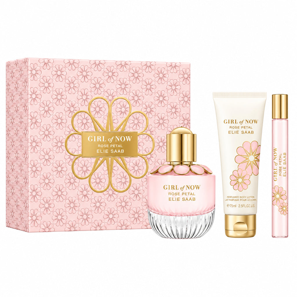 Elie Sair Girl of Now Rose Pital fragrance gift set featuring a pink floral patterned box, a pink perfume bottle with a gold cap, a white lotion tube with pink floral graphics and a gold cap, and a matching pink travel spray vial with a gold cap, all displayed on a white background with a transparent checkered cutout overlay.