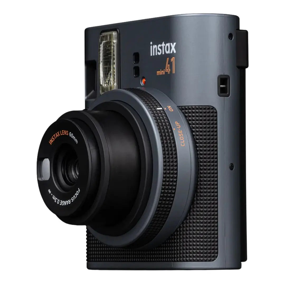 Close-up shot of the Instax Mini 41 lens and textured grip detail.