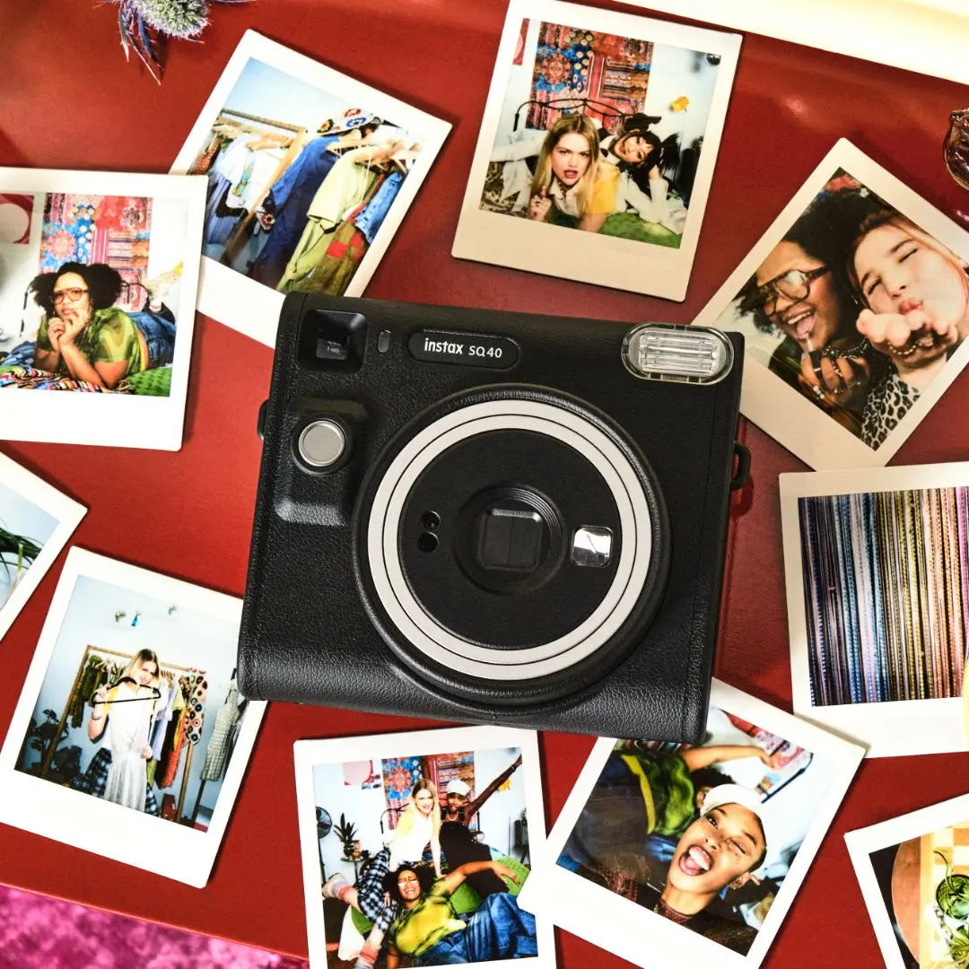 Fujifilm Instax SQ40 Instant camera with instant photos on a red surface