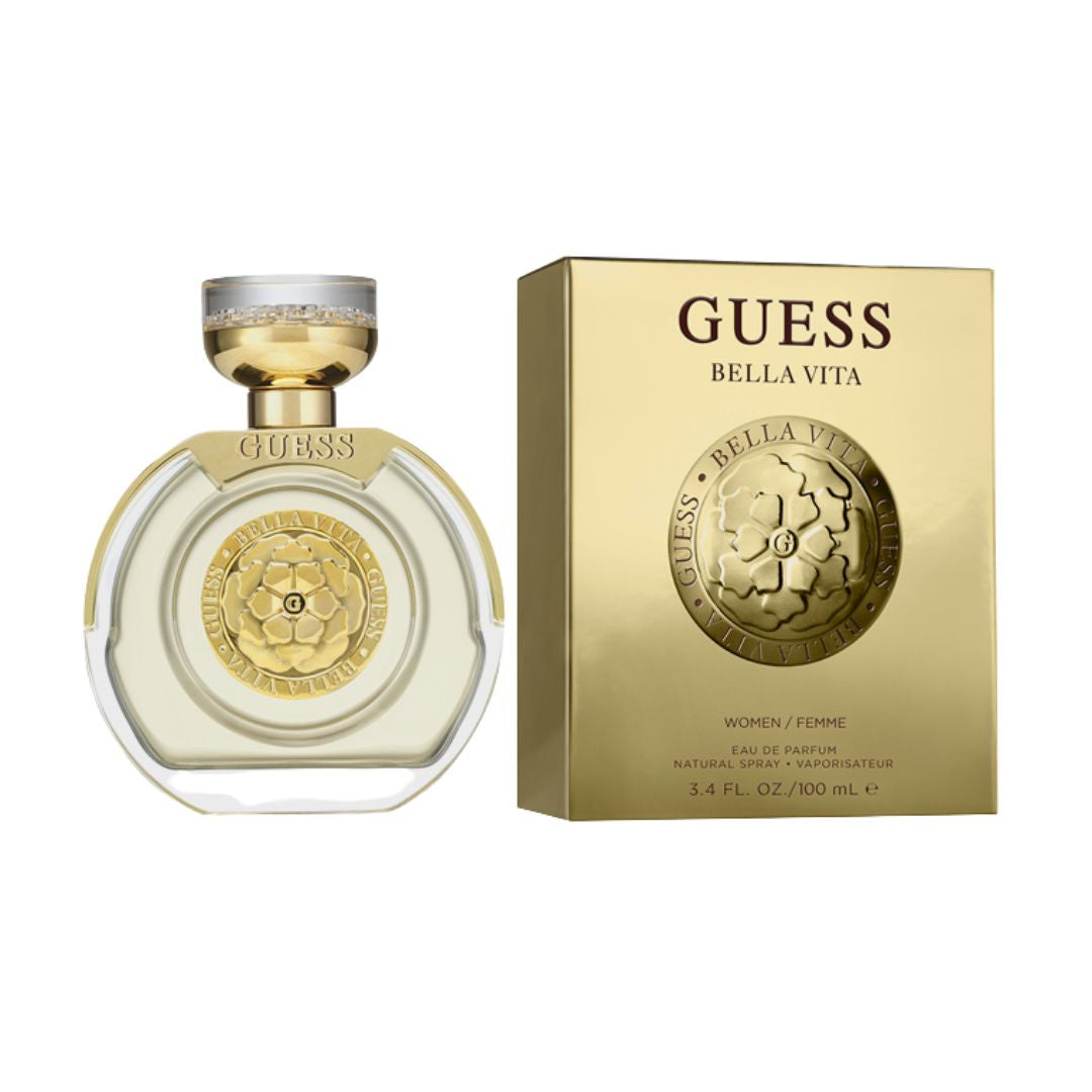 Guess Bella Vita 100ml EDP, a sleek gold bottle with a bold design, suggesting a vibrant, fruity, and gourmand feminine fragrance