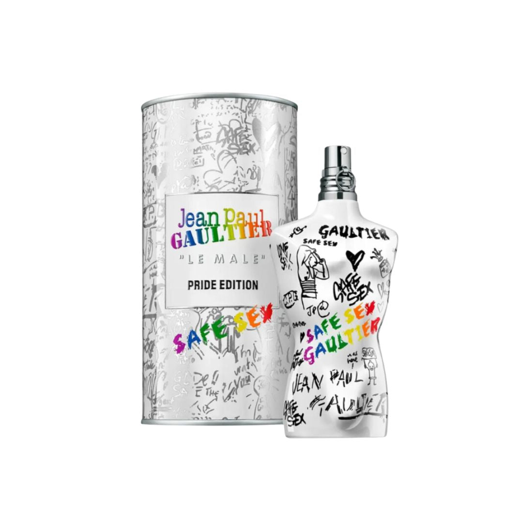 Jean Paul Gaultier Le Male Pride Edition perfume bottle and its cylindrical packaging box, both decorated with black graffiti-style drawings and rainbow-colored text, on a plain white background.