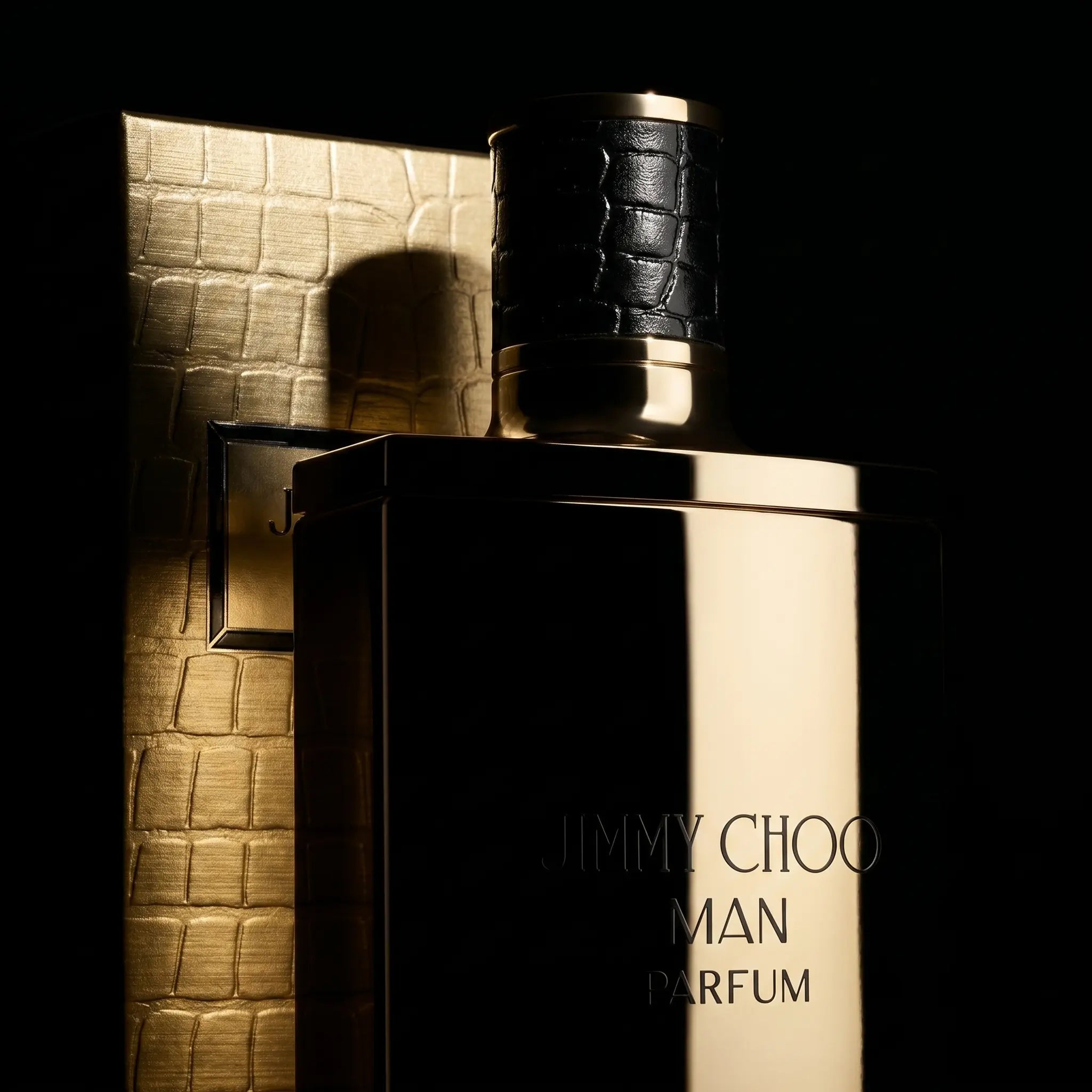 Jimmy Choo Man Parfum bottle and packaging on a dark background
