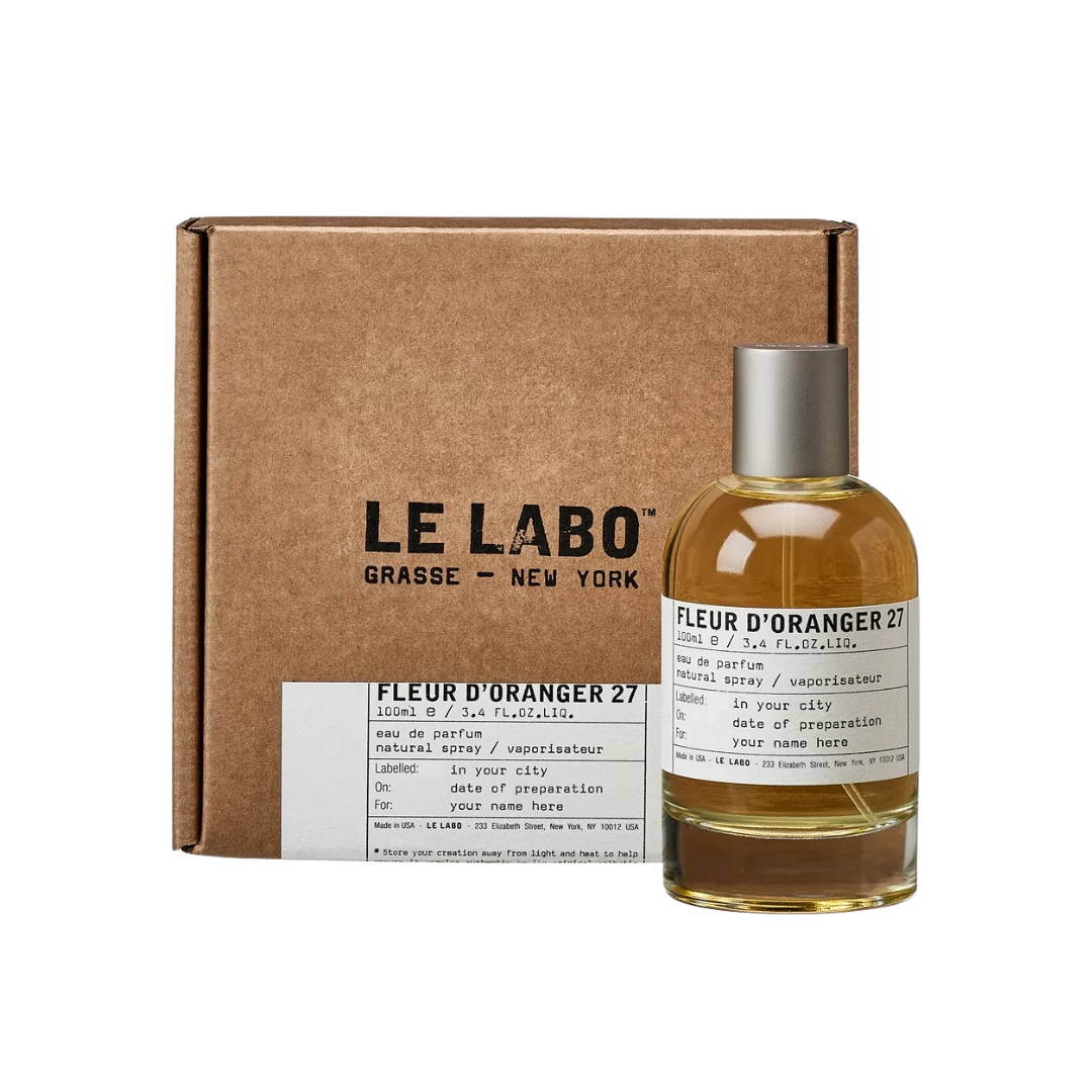 Le Labo Fleur D'Oranger 27 EDP 100ml, a minimalist amber glass bottle with a classic label, suggesting a natural, intense, citrus floral unisex fragrance.