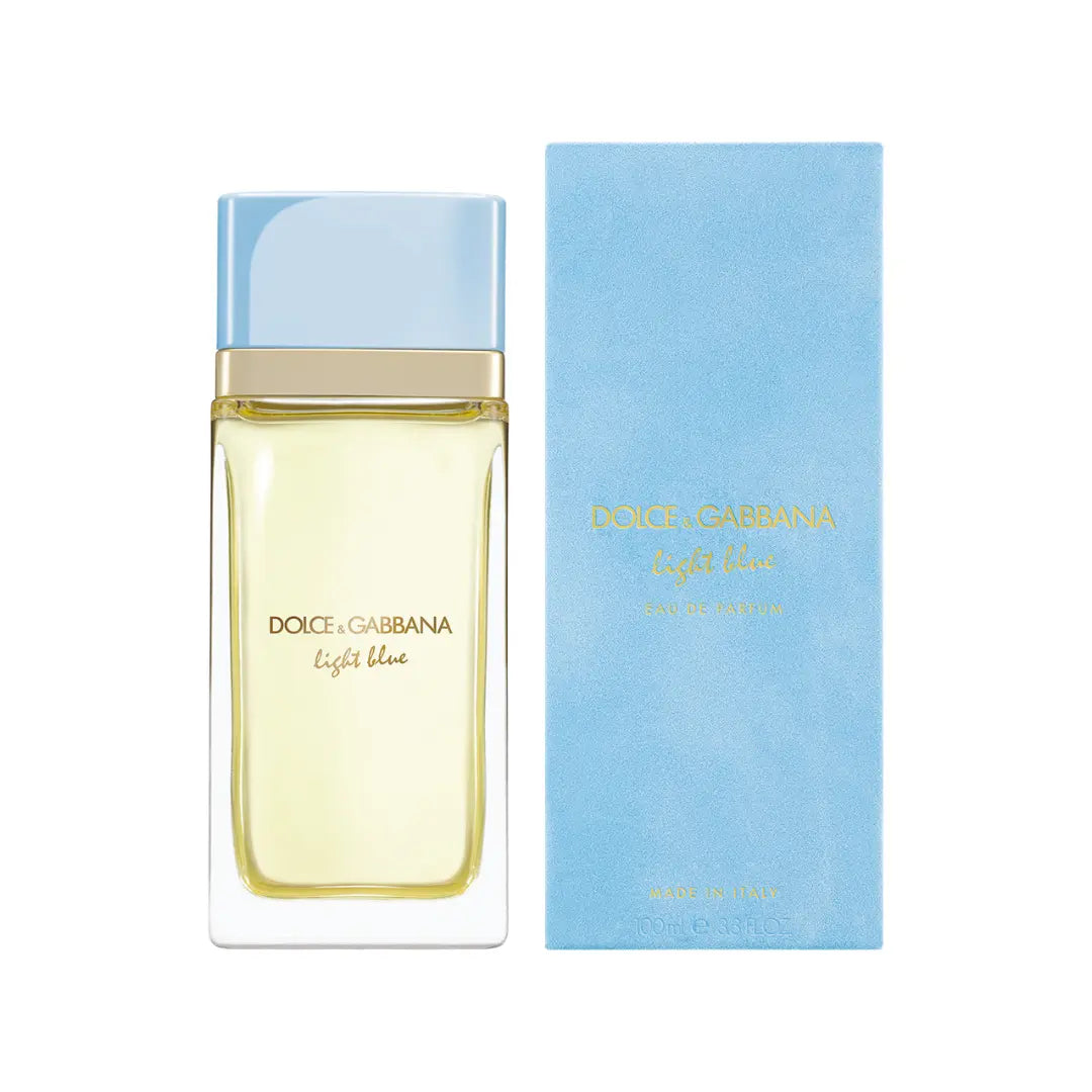 Dolce Gabbana Light Blue Eau de Parfum bottle with a light blue cap and pale yellow liquid, shown next to its light blue box on a white background.