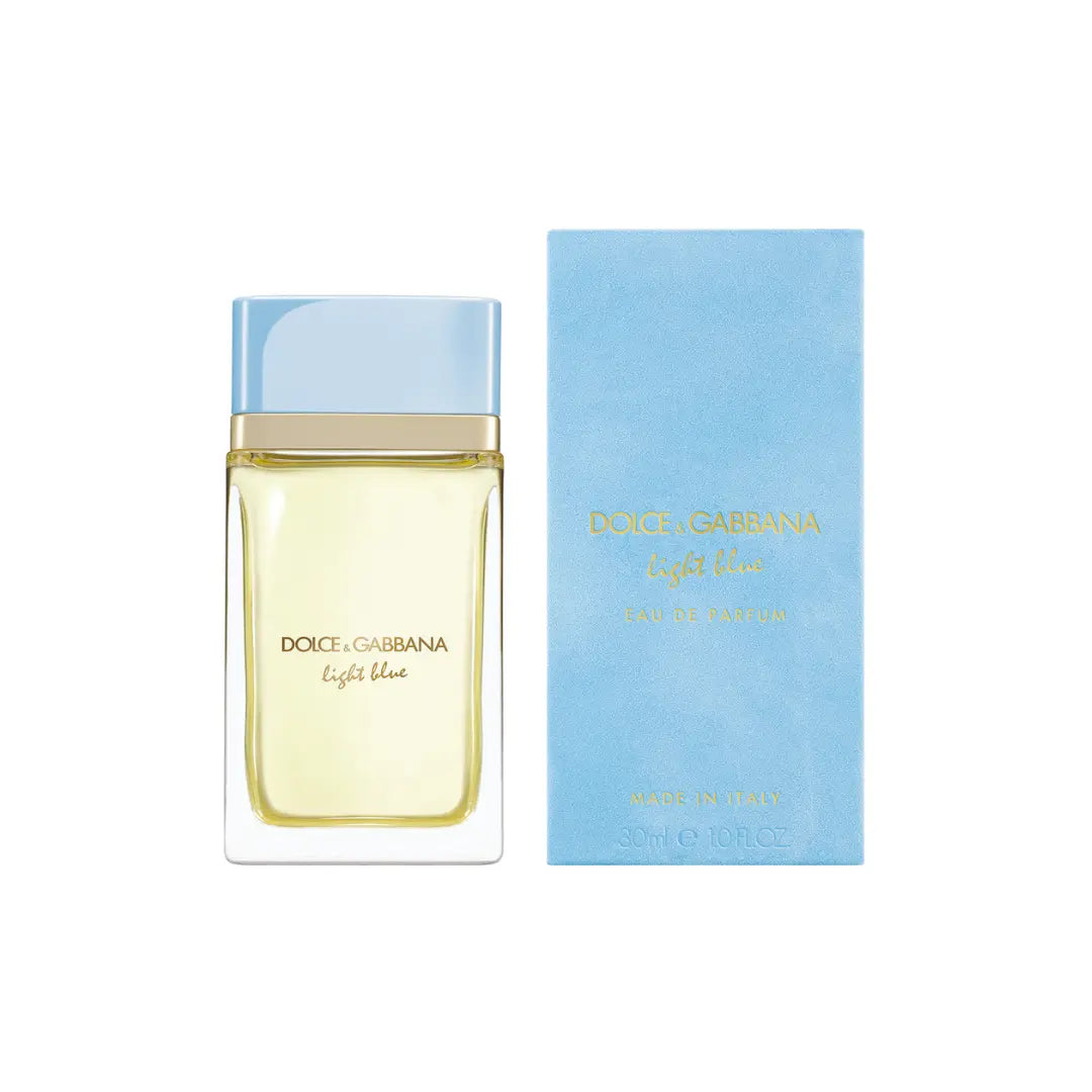 Diority Gabbana Light Blue Eau de Toilette bottle with a light blue cap and pale yellow liquid, shown next to its light blue box on a white background.