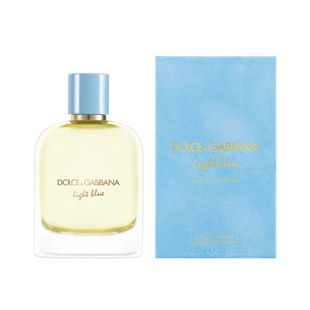 Dolce & Gabbana Light Blue Eau de Parfum bottle with pale yellow liquid and a light blue cap, shown next to its light blue packaging box on a white background.