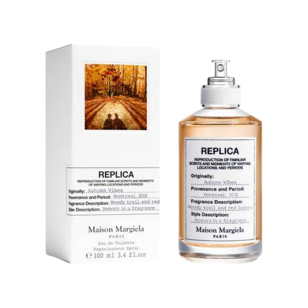 Maison Margiela Replica Autumn Vibes 100ml EDT, a clear bottle with a warm, earthy liquid, evoking the fresh, woody scent of autumn in NZ