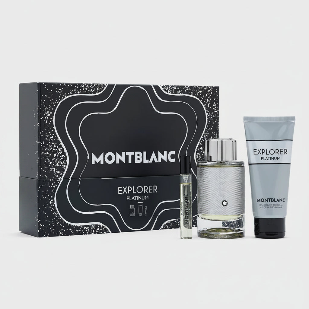 Montblanc Explorer Platinum fragrance gift set with a black patterned box, a silver-toned perfume bottle, a small sample vial, and a matching body care tube on a light gray background.