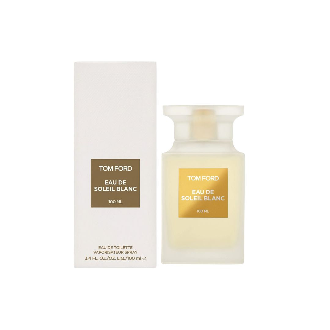 Tom Ford Eau de Soleil Blanc Eau Toilette 100ml bottle next to its white packaging box, both featuring a gold label on a white background.
