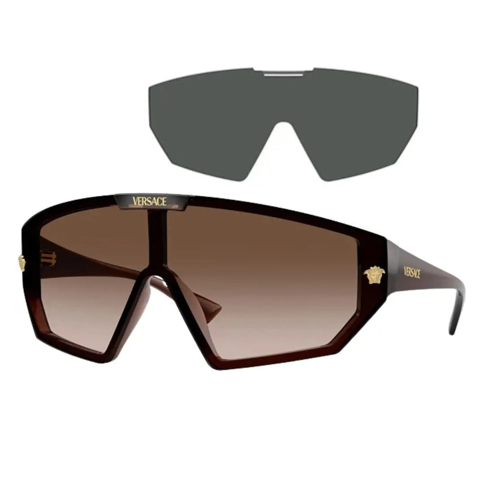Versace VE4461 533213 shield sunglasses with grey interchangeable lenses in transparent brown with brown gradient lenses and gold Medusa - Gadgets Online NZ