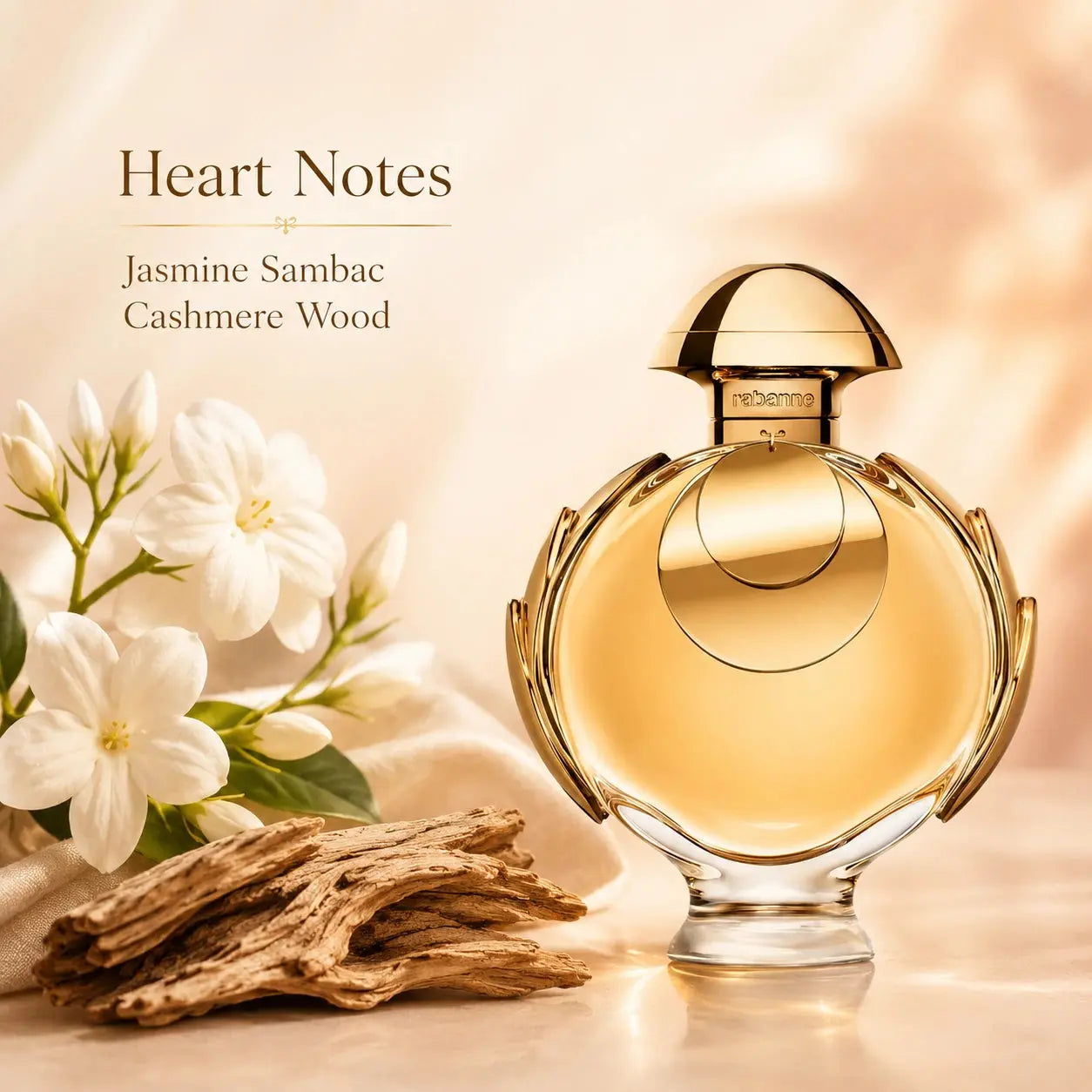 Rabanne Olympea Elixir EDP Intense 50ml heart notes visual highlighting jasmine and cashmere wood in a luxurious layout.