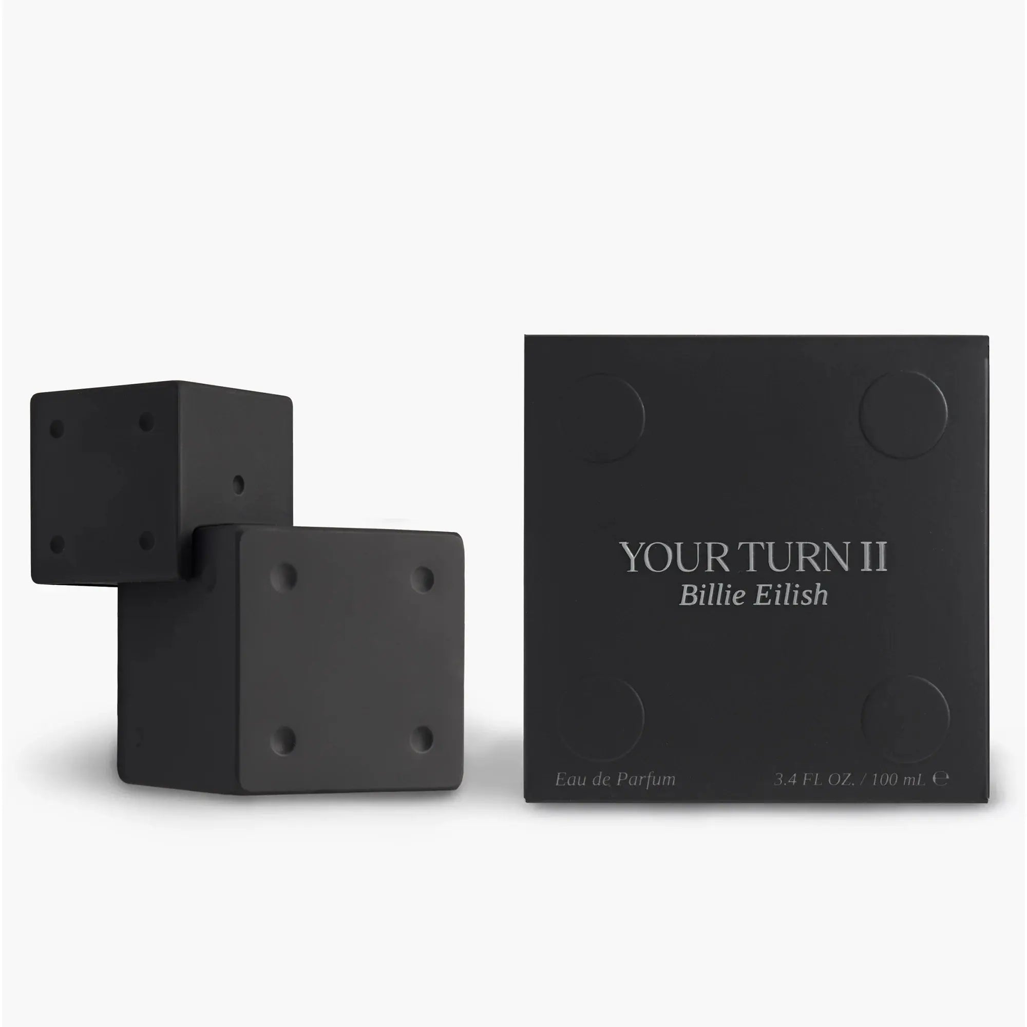 Black 'Your Turn II' Billie Eilish perfume bottle and packaging on a white background