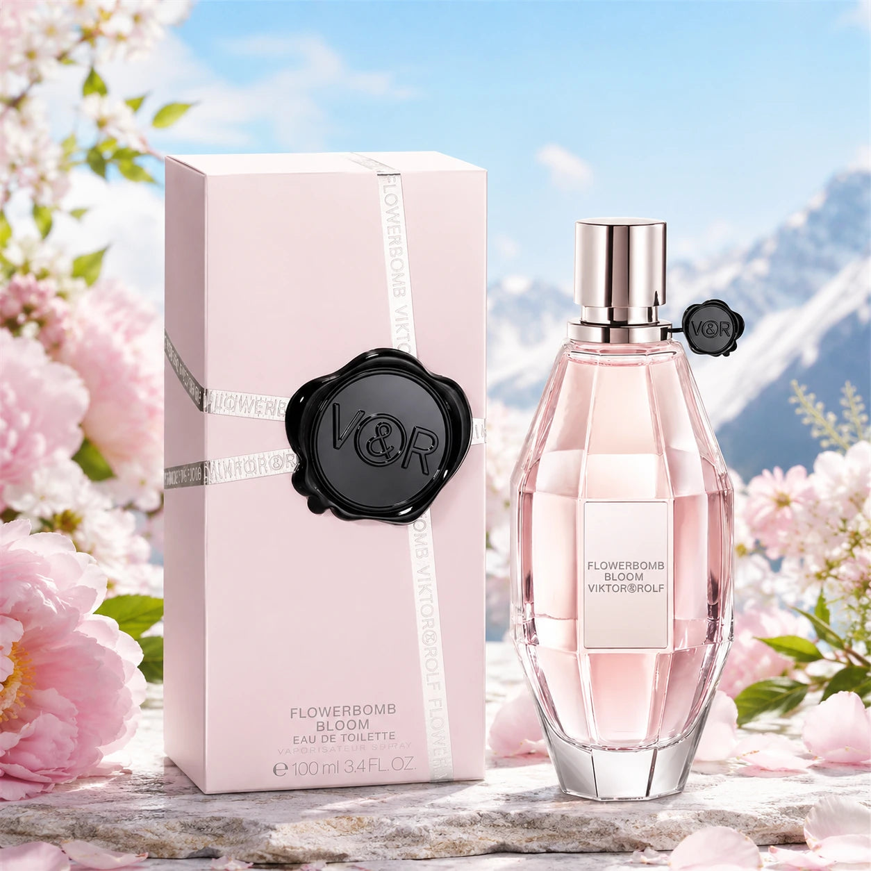 Viktor & Rolf Flowerbomb Bloom EDT 100ml hero image with the original pink bottle and box in a fresh spring floral mountain-air inspired scene at Gadgets Online NZ.
