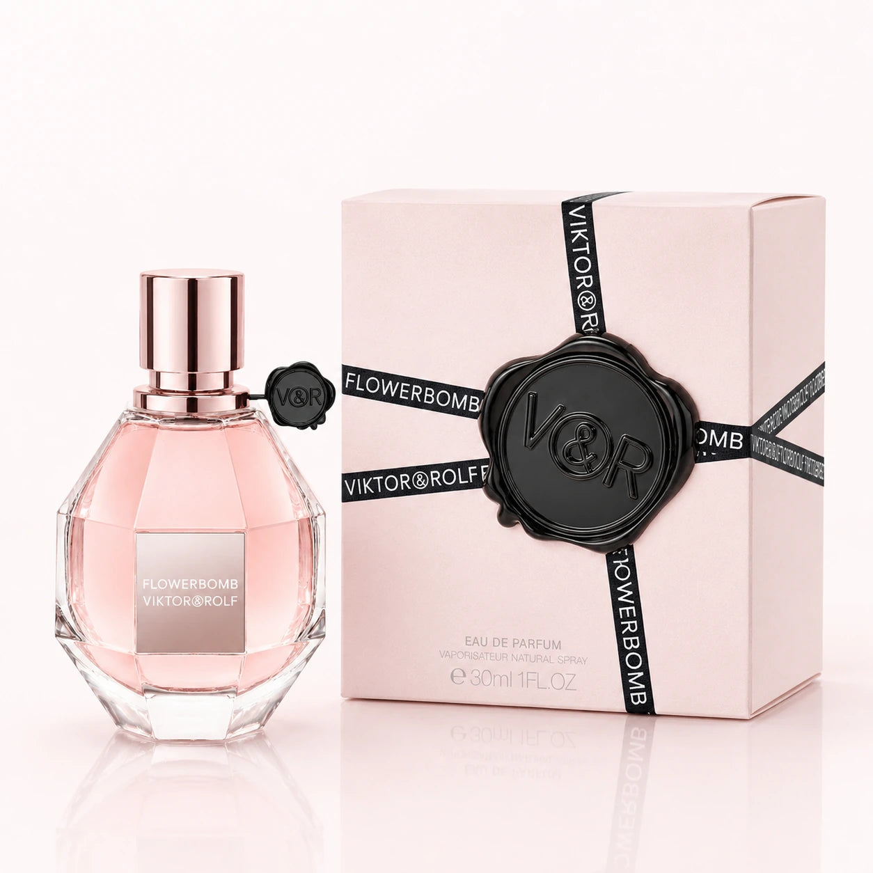 Viktor & Rolf Flowerbomb EDP 30ml women's perfume clean product image showing the original bottle and pink box on a bright studio background.
