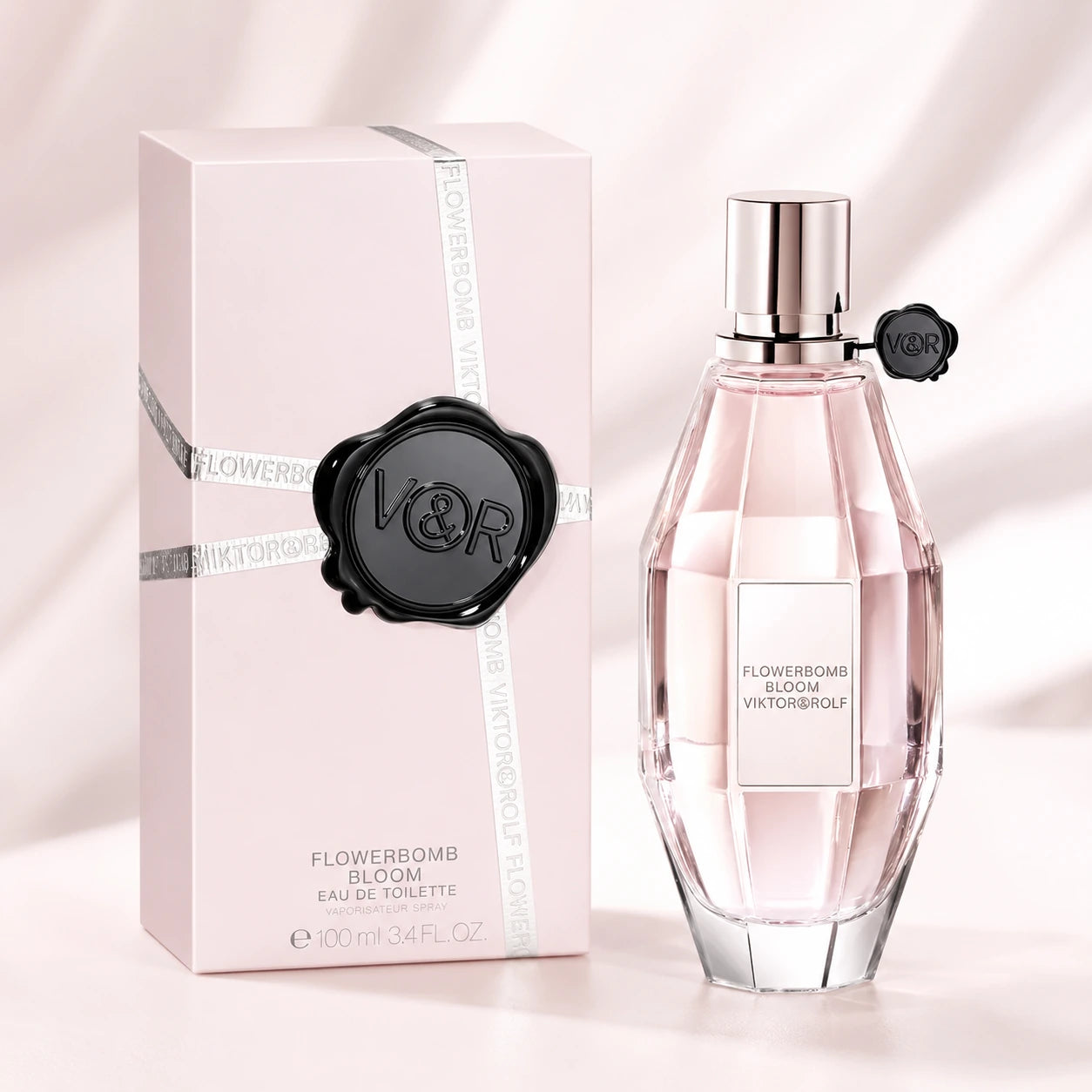 Viktor & Rolf Flowerbomb Bloom EDT 100ml clean ecommerce image showing the original bottle and pale pink box at Gadgets Online NZ.
