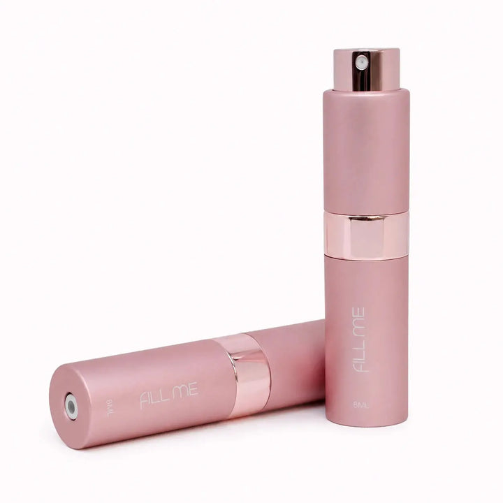 Fill Me refillable 8ml travel perfume atomiser bottle pink clean product image showing two pink atomisers on a bright minimal background.