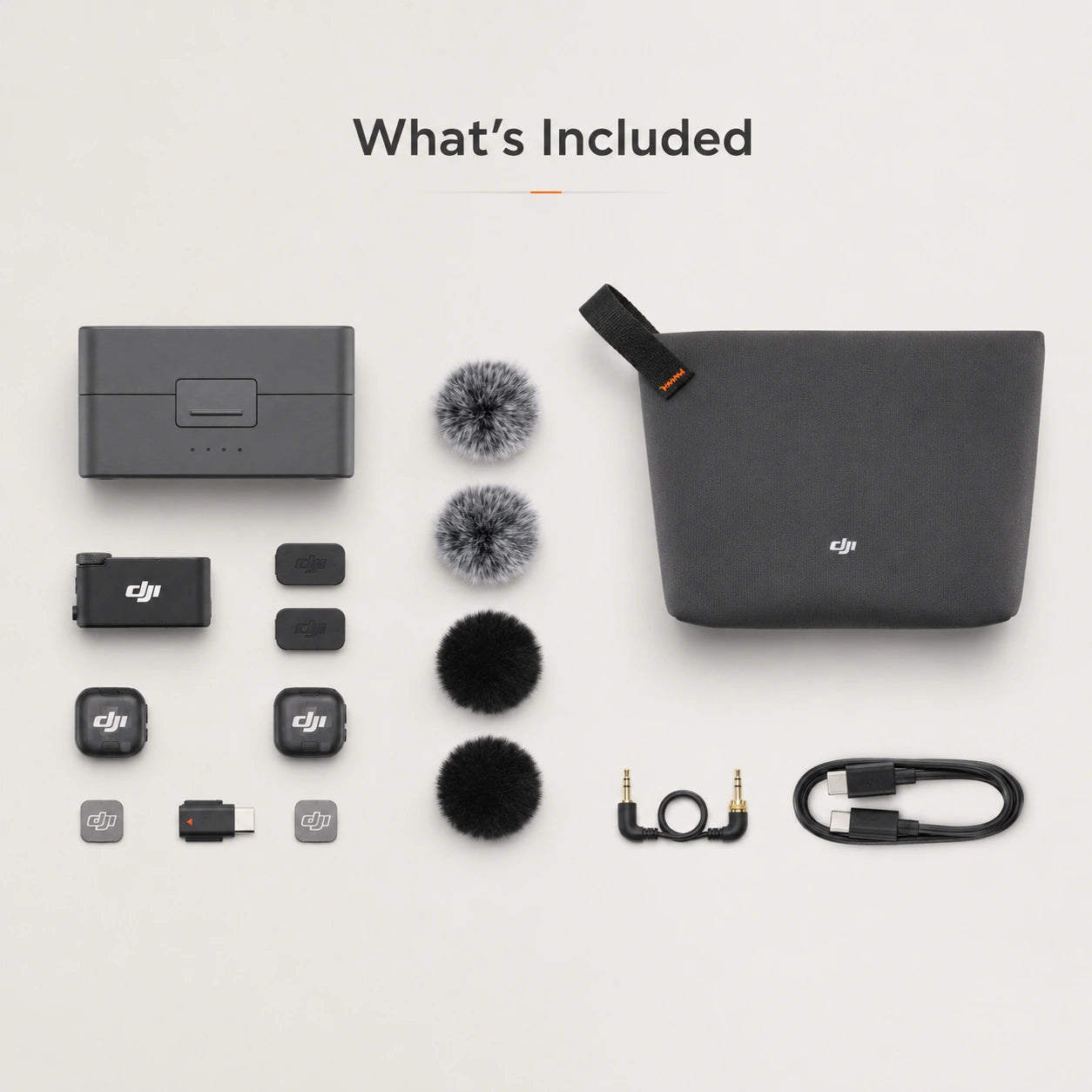 Collection of DJI accessories including a case, microphone, and cables on a light gray background.
