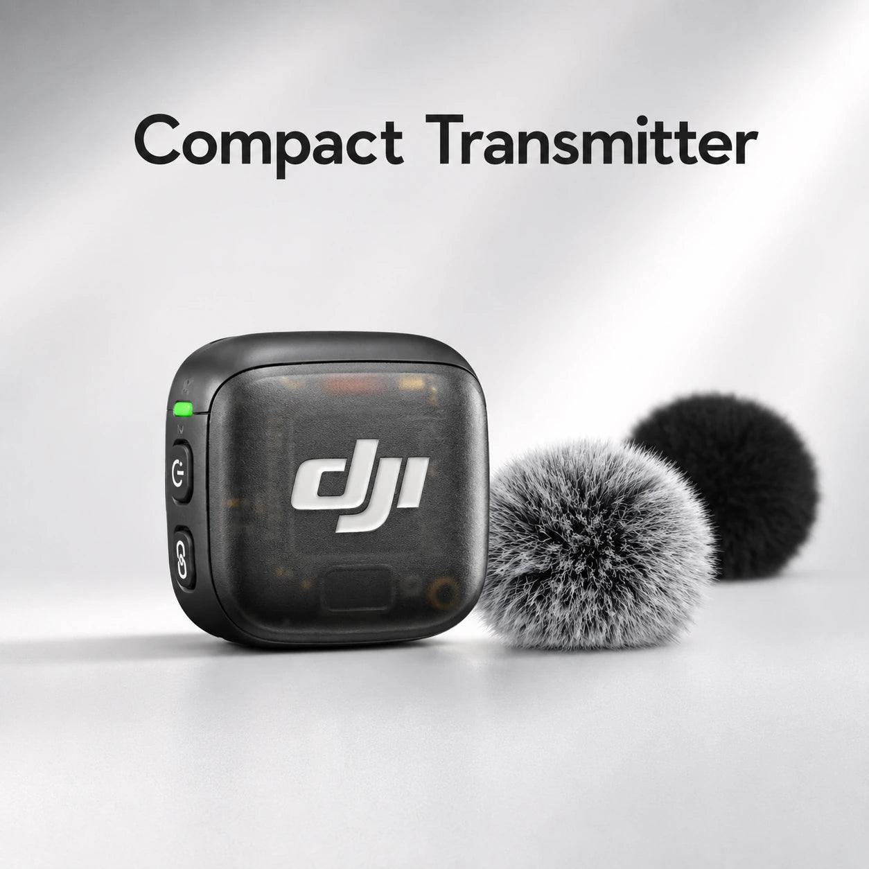 Compact transmitter with DJI logo and two microphones on a light gray background