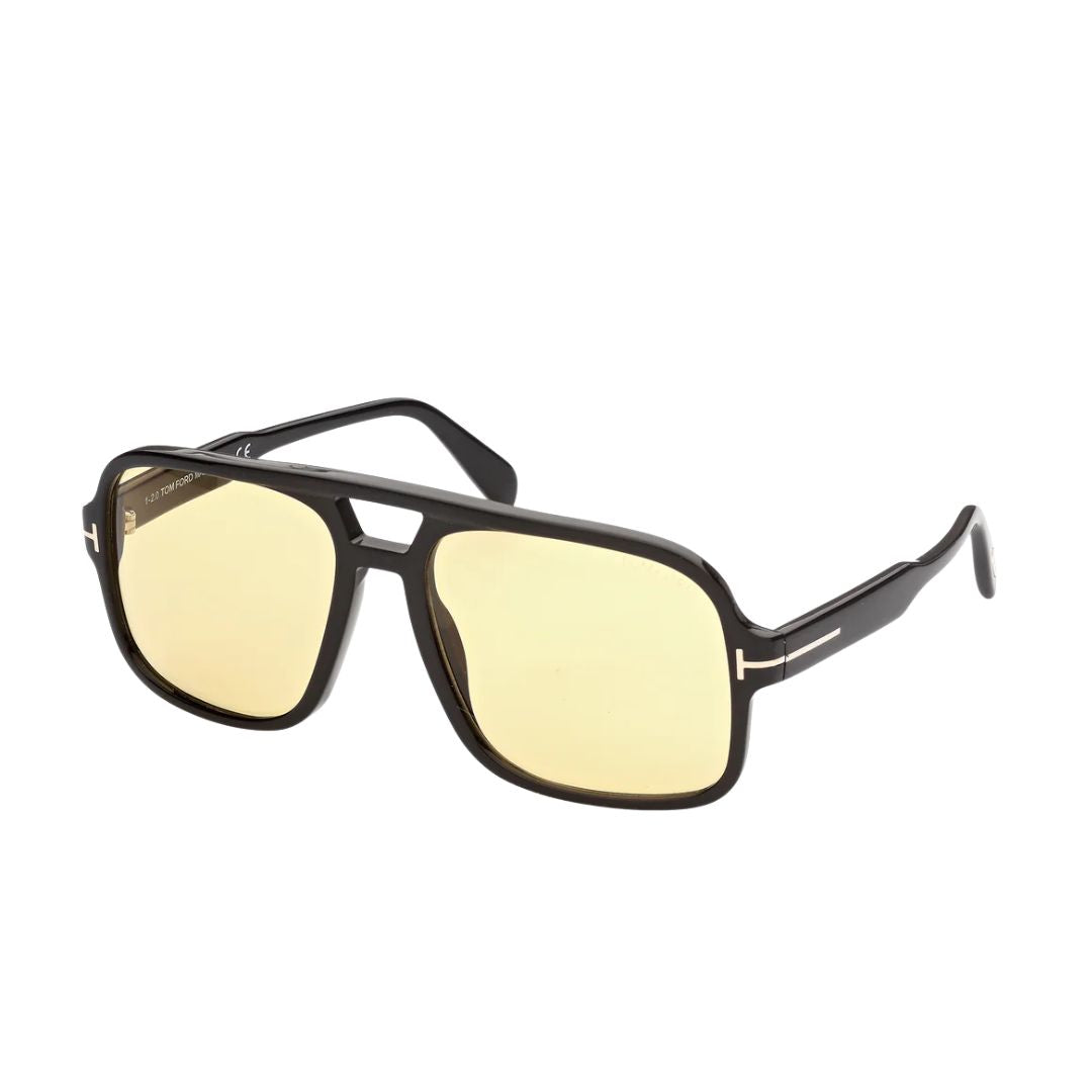 Tom Ford FT0884 Falconer sunglasses for men, featuring a bold glossy black acetate navigator frame. The amber brown lenses are paired with the signature gold 'T' logo at the temples.