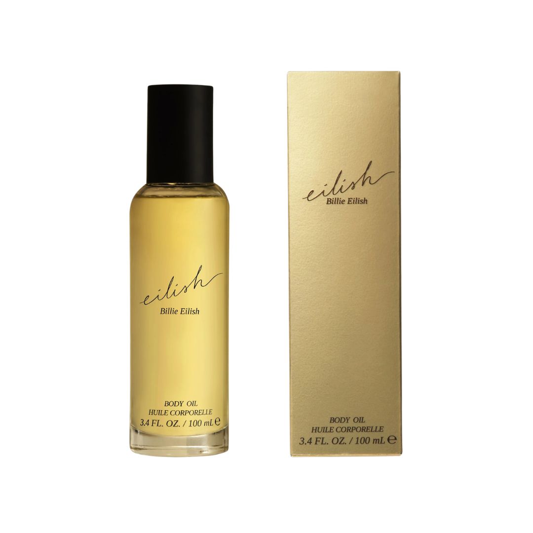 Billie Eilish Eilish Body Oil 100ml, a sleek bottle containing a nourishing vanilla and cocoa scented body oil for a radiant skin glow.