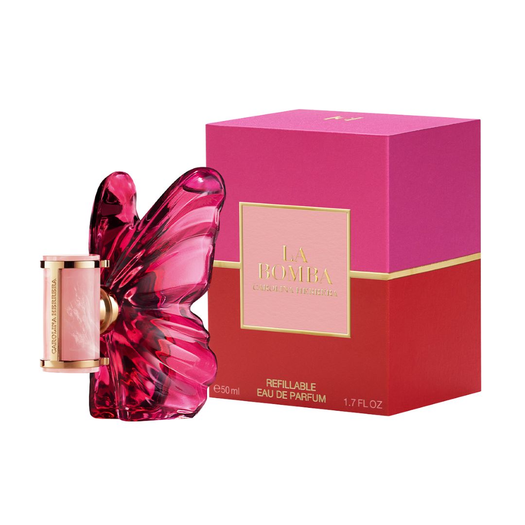La Bomba Refillable Eau de Parfum 50ml bottle with a butterfly-shaped pink glass body, shown next to its pink and red packaging box with gold lettering.