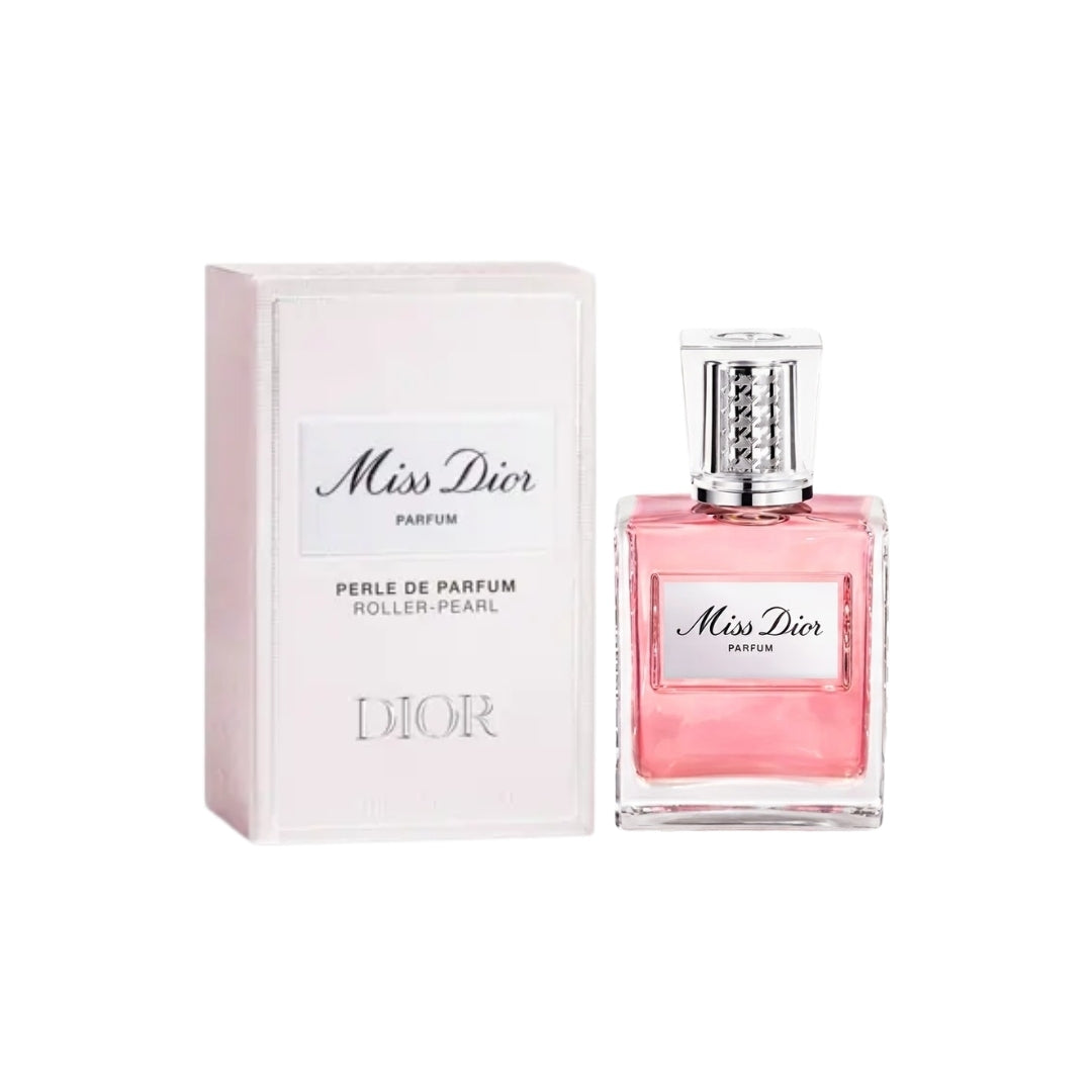Miss Dior Perle de Parfum roller-pearl fragrance shown with its pale pink box and the clear glass perfume bottle filled with pink liquid, on a white background.