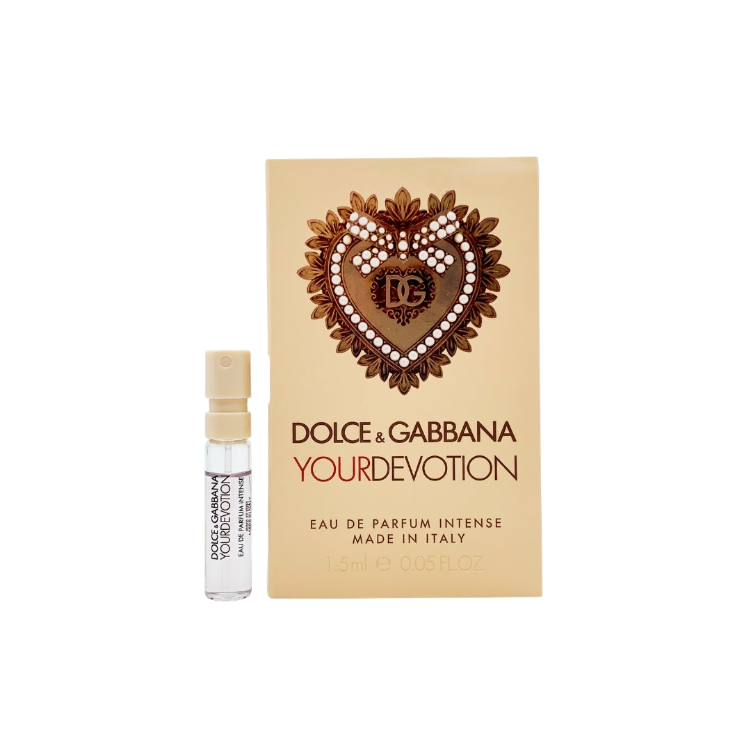 Dolce & Gabbana Your Devotion Eau de Parfum 1.5ml sample vial next to its beige packaging box, featuring a heart-shaped crystal and gold emblem.