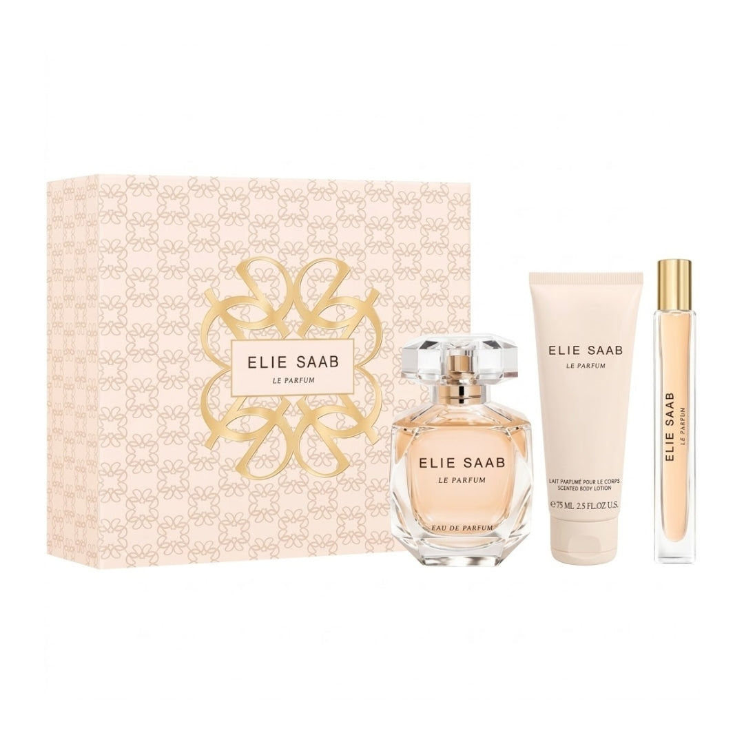 Elie Saab Le Parfum gift set featuring a 100ml perfume bottle, a 70ml travel spray, and a matching body lotion tube, displayed alongside a patterned gift box on a white background.