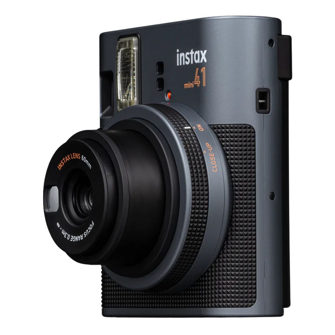 Close-up shot of the Instax Mini 41 lens and textured grip detail.