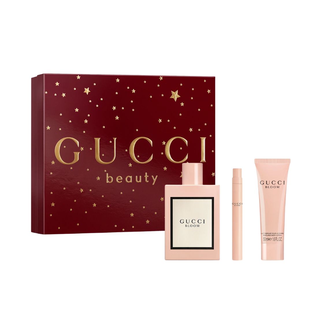 Gucci Bloom 3pc Gift Set, a pink and green floral box containing the iconic square 100ml EDP bottle, a 10ml pen spray, and 50ml body lotion, suggesting an intense, rich white floral scent.