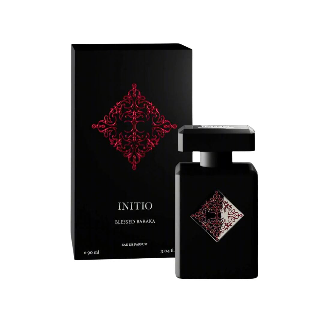 Initio Parfums Prives Blessed Baraka 90ml EDP, a sleek, dark bottle with an intricate gold geometric emblem, suggesting a radiant, spiritual, and commanding unisex fragrance.