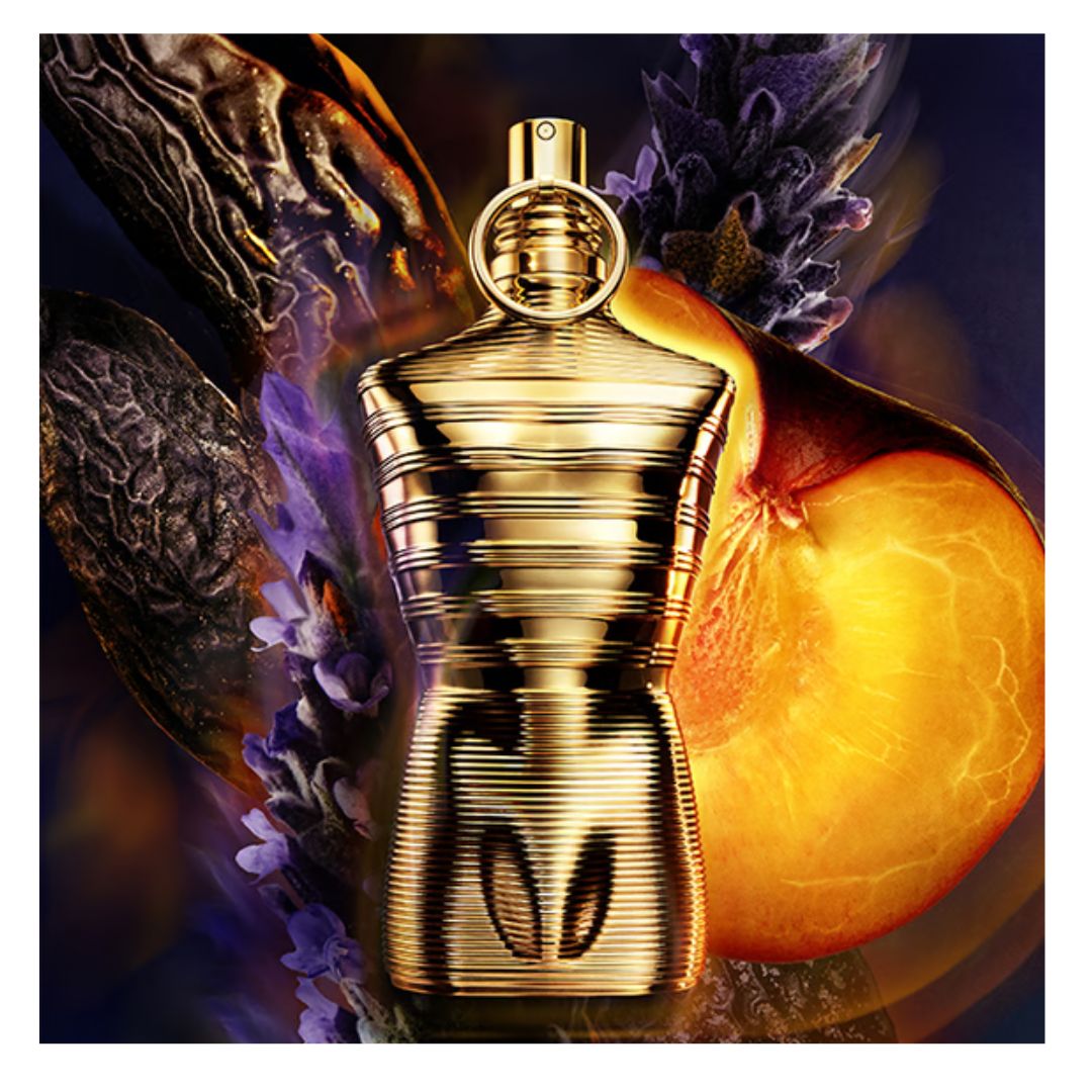JPG Gold perfume bottle with fruit and floral elements on a dark background