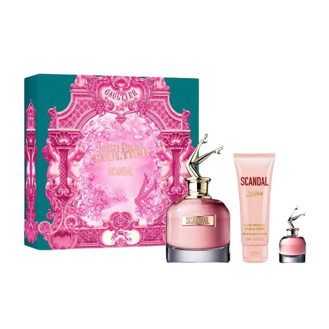 Jean Paul Gaultier Scandal 3pc Gift Set, a bold pink and gold box containing the 80ml EDP with the unique leg cap, 75ml Body Lotion, and 6ml miniature, suggesting a powerful, sweet, honey-gourmand scent.